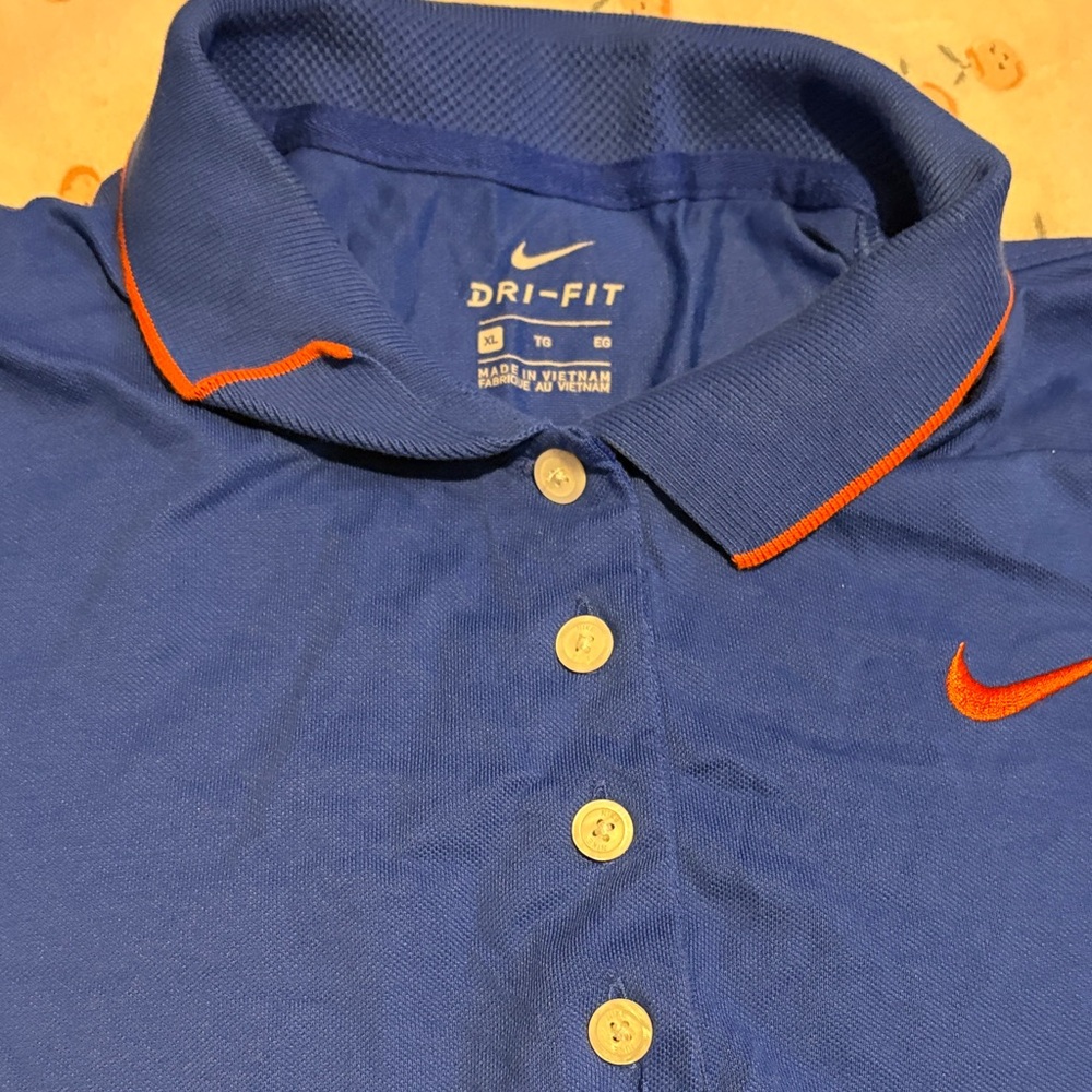 Nike Men's Dri-FIT Polo in Blue with Orange Details